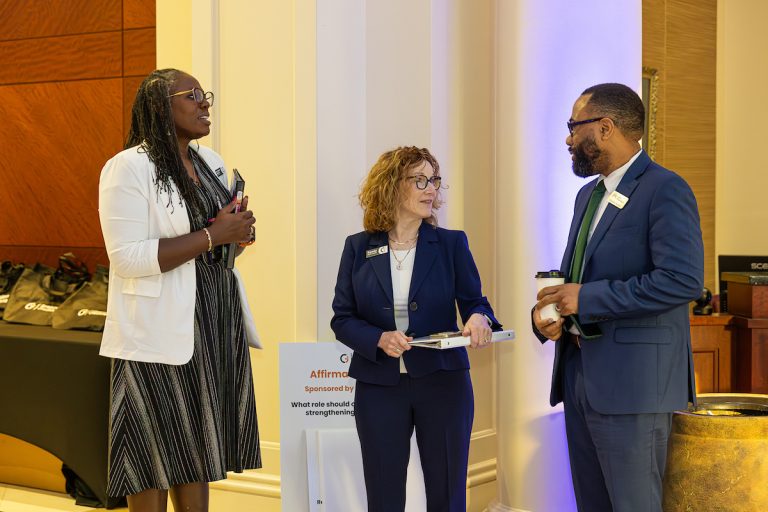 Shannon Hervey, Renee Byrd-Lewis, and Brandon Garner standing in the lobby